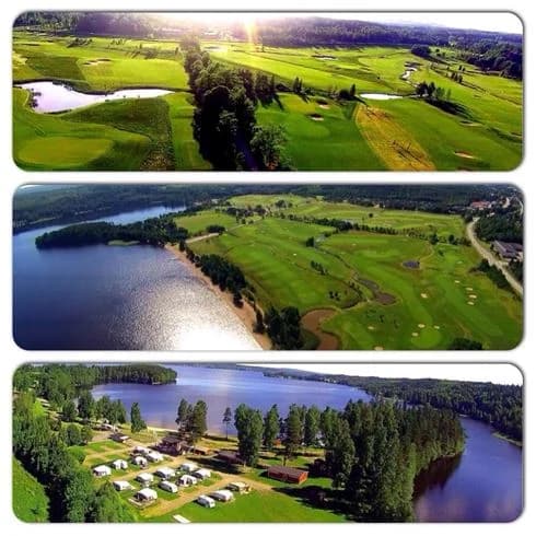 Fågelperspektiv över Degernäs camping, med grönskande omgivningar och parkstrukturer sedda från luften.